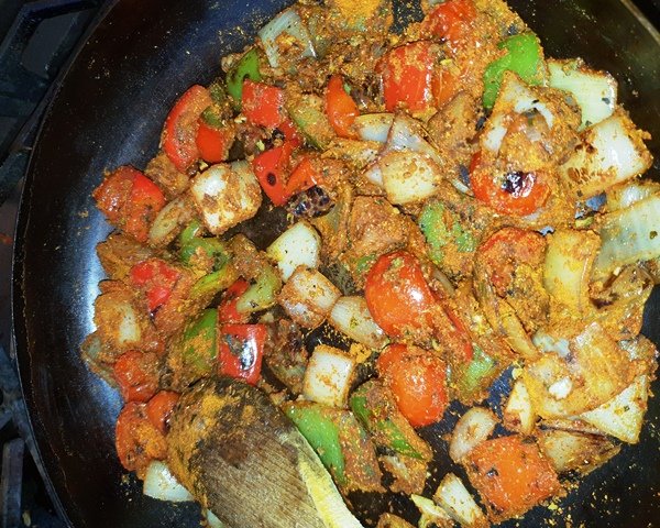 Pan tossed and the garlic and ginger added after 30 seconds the powdered spices added