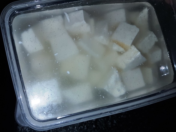 Cut into cubes, placed in water,